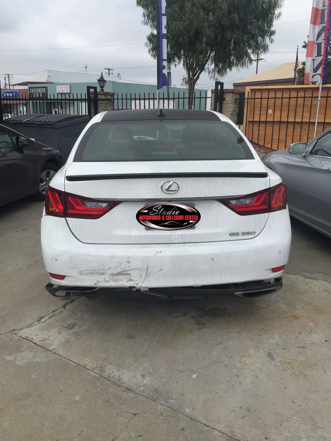 Lexus GS 350 with scraped rear bumper before repair