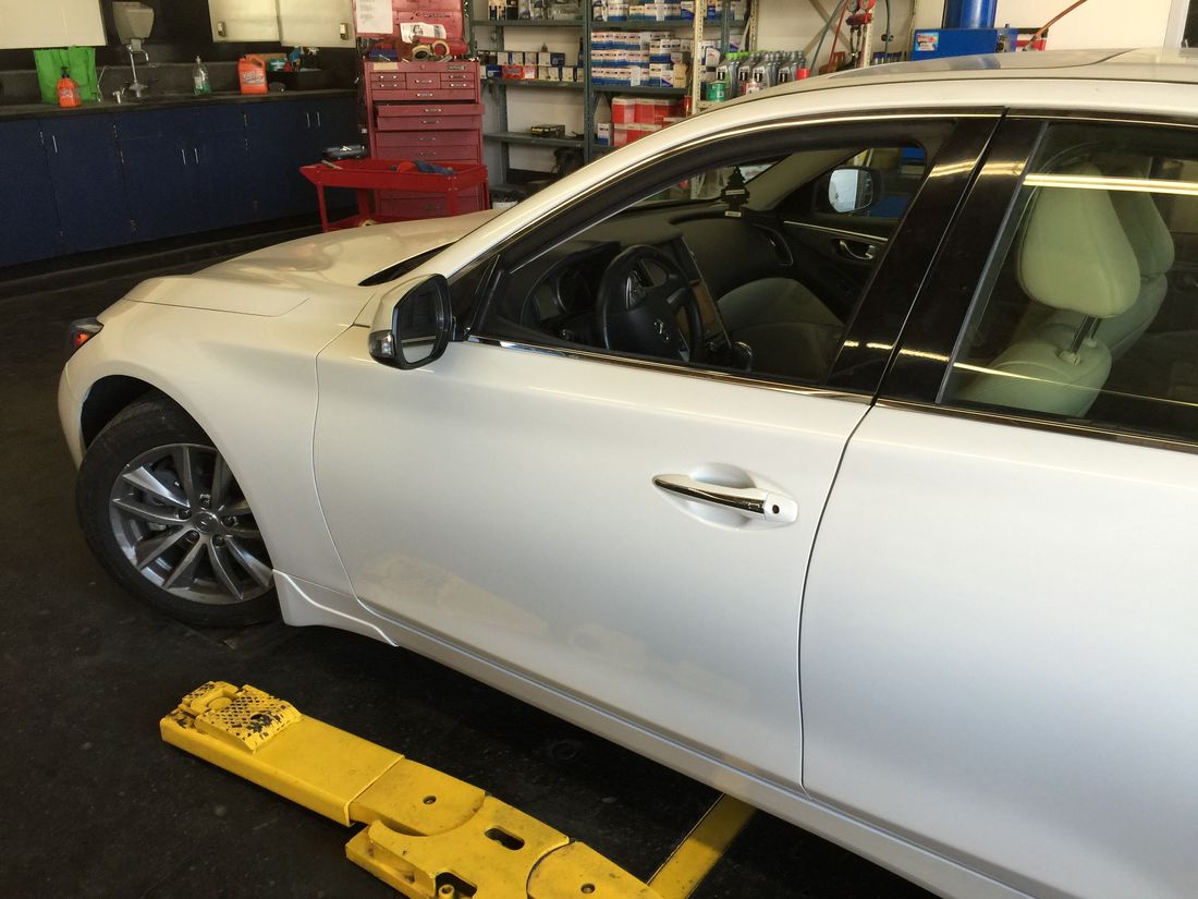 Infiniti Q50 door fully repaired and refinished after collision repair