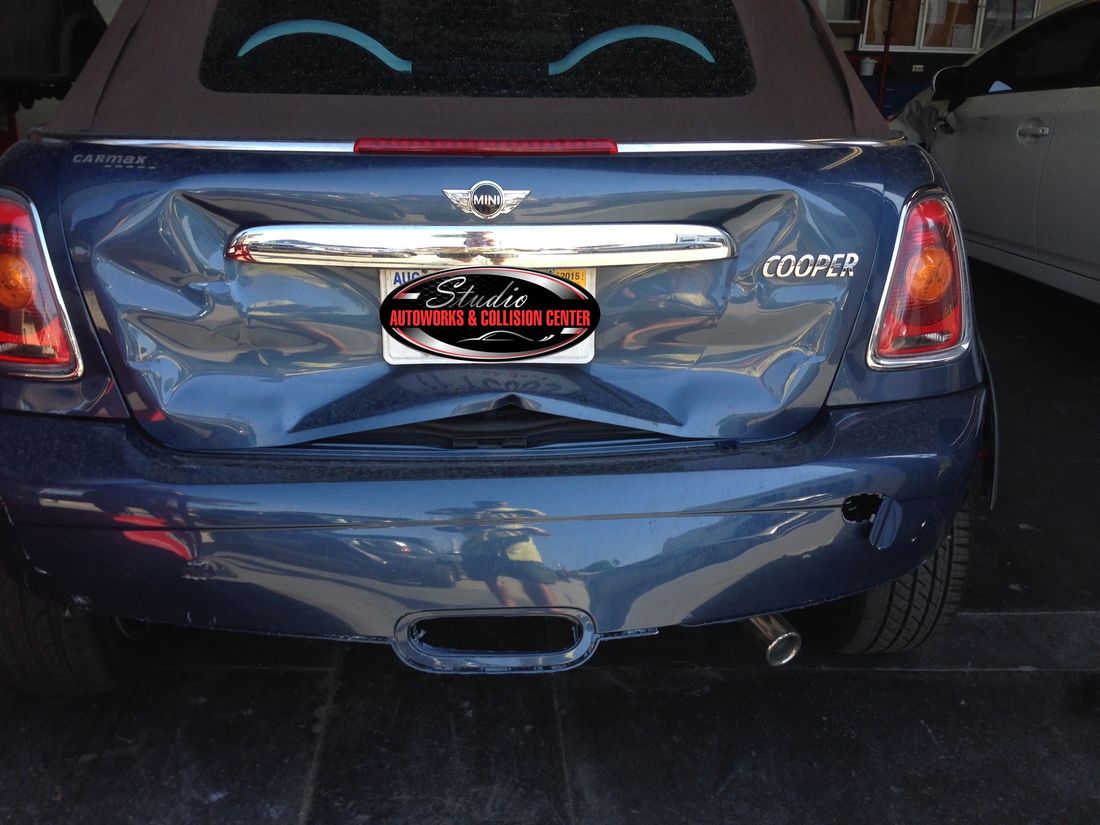 Mini Cooper Convertible with crumpled rear bumper before repair