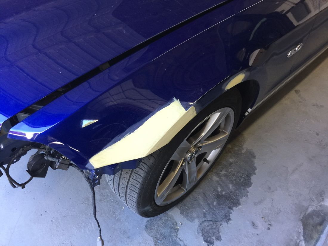 Classic Ford Mustang in primer during exterior repaint
