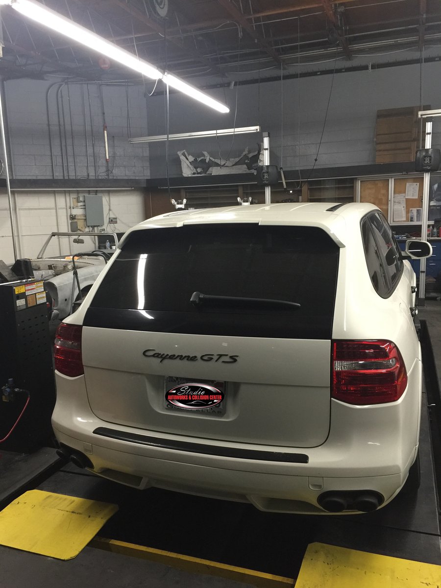 Porsche Cayenne GTS on the alignment rack at Studio Autoworks & Collision Center
